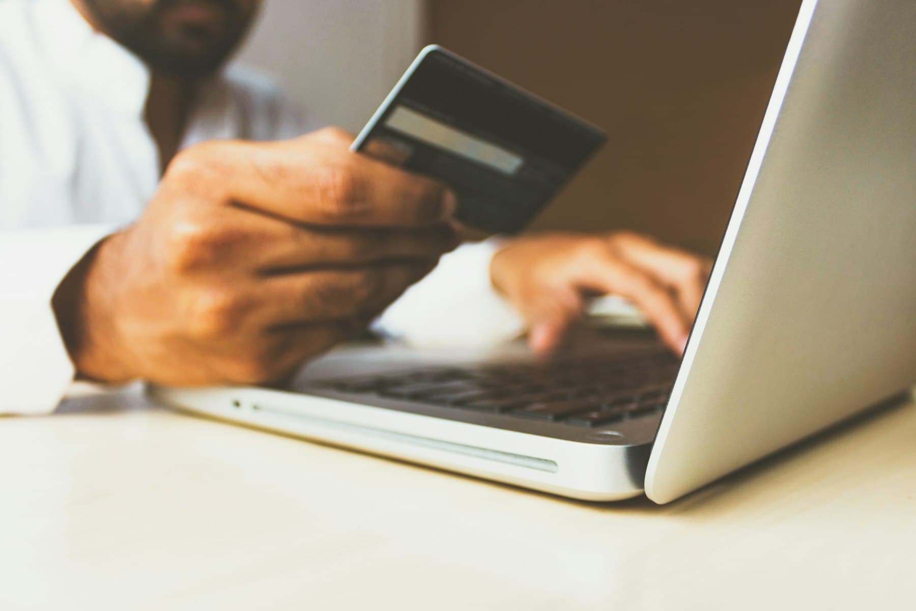 Customer completing an online card payment at checkout